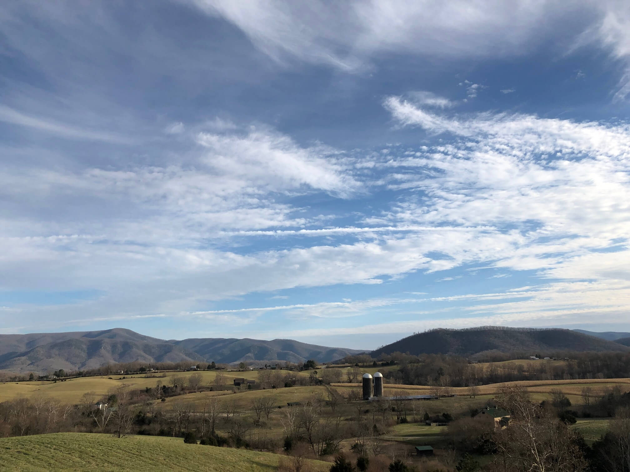 Clouds Over the Farm and Mountains